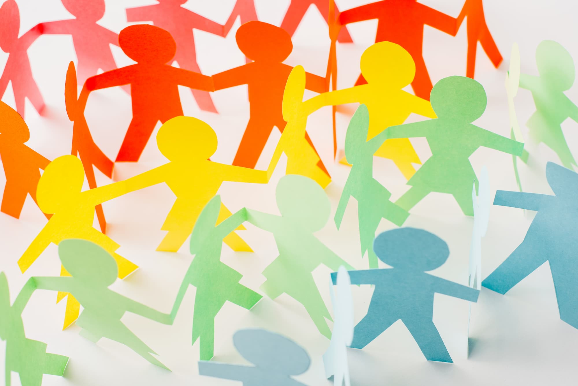 Paper cut figures representing connected people and community